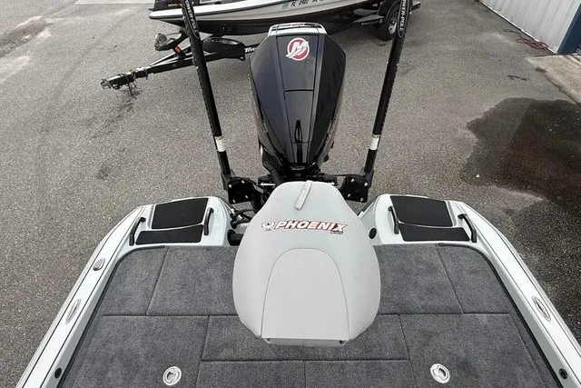Slide: The Image of The image shows the rear of a 2027 Phoenix 921 Elite X II boat with a Mercury engine. - 11