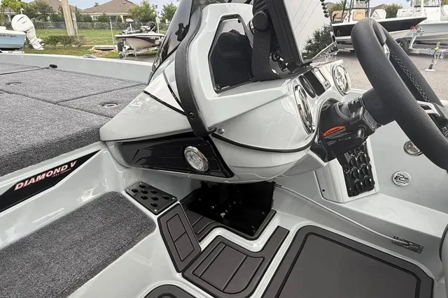 Slide: The Image of The image shows the cockpit of a 2027 Phoenix 921 Elite X II boat with modern instruments. - 14