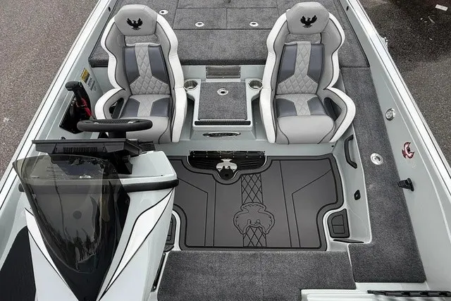 Slide: The Image of The image shows the cockpit of a 2027 Phoenix 921 Elite X II boat with two padded seats. - 10