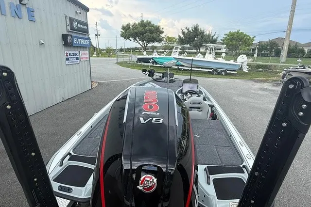 Slide: The Image of The image shows a 2027 Phoenix 921 Elite X II boat with a powerful V8 engine. - 5
