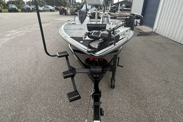 Slide: The Image of A 2027 Phoenix 921 Elite X II boat on a trailer, ready for transport. - 9