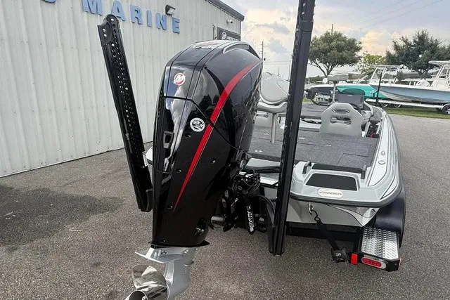 Slide: The Image of The image shows a 2027 Phoenix 921 Elite X II boat with a powerful outboard motor. - 4