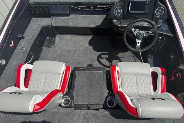 Slide: The Image of Interior of a Phoenix 819 ZXL boat with gray and red seats. - 15