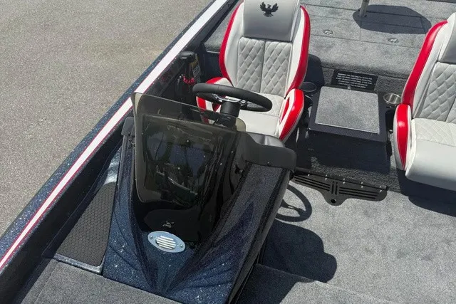 Slide: The Image of The image shows the cockpit of a 2027 Phoenix 819 ZXL boat with gray and red seats. - 18
