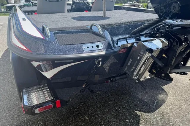 Slide: The Image of The image shows the rear of a Phoenix 819 ZXL boat with motor and platform. - 6