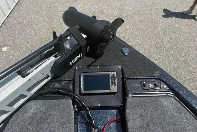 Slide: The Image of The image shows the deck of a Phoenix 819 ZXL boat with a Minn Kota trolling motor and a Lowrance fish finder. - 17