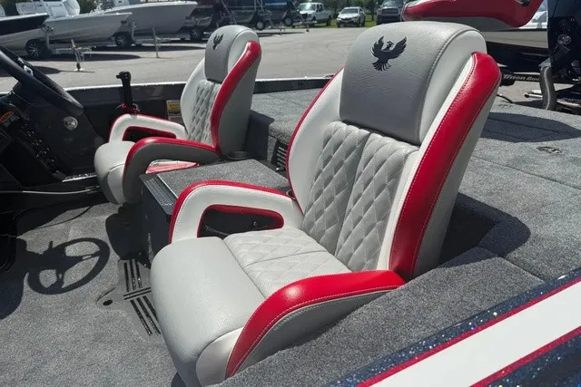 Slide: The Image of The 2027 Phoenix 819 ZXL features luxurious, padded seats with red accents and a sleek design. - 10