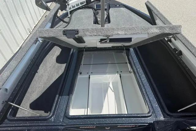 Slide: The Image of The image shows the open storage compartment of a 2027 Phoenix 819 ZXL boat. - 20