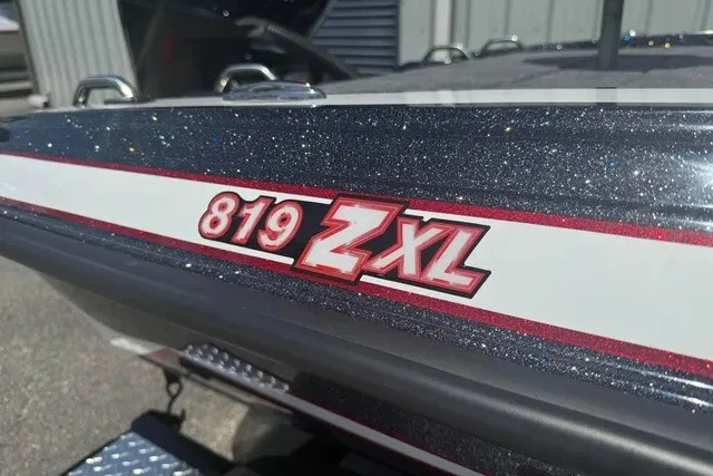 Slide: The Image of Close-up of the Phoenix 819 ZXL with glittering paint and red logo. - 3