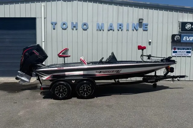 The Image of A Phoenix 819 ZXL boat on a trailer in front of a building labeled "TOHO MARINE." - 1
