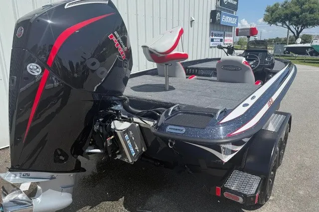 Slide: The Image of A 2027 Phoenix 819 ZXL boat with a powerful outboard motor, on a trailer. - 4