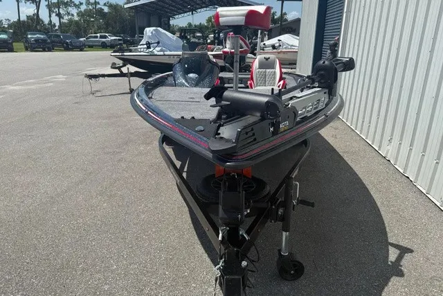 Slide: The Image of A 2027 Phoenix 819 ZXL boat on a trailer in an outdoor setting. - 13