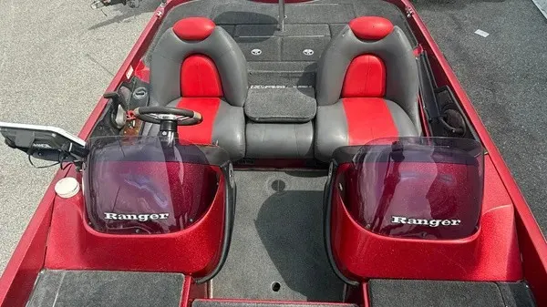 Slide: The Image of The image shows the cockpit of a red 2007 Ranger 519 VX boat with two seats. - 9