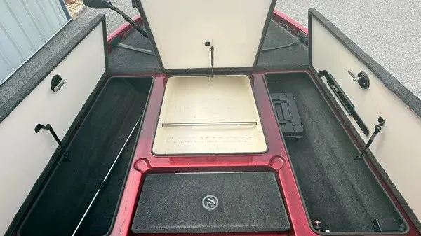 Slide: The Image of The image shows the open deck of a 2007 Ranger 519 VX boat with multiple storage compartments. - 11