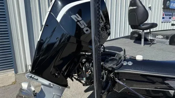 Slide: The Image of A black outboard motor labeled "250" is attached to a boat. - 6