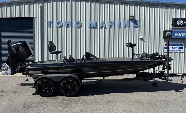 The Image of A black 2020 Blazer 625 Pro Elite boat on a trailer in front of a building. - 1