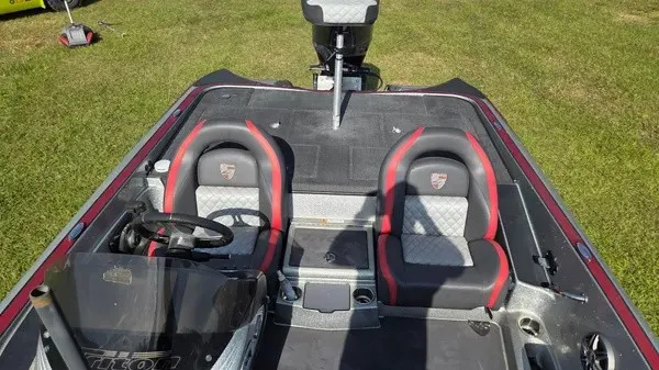 Slide: The Image of The image shows the cockpit of a 2021 Triton 20 TrX boat with two padded seats. - 8