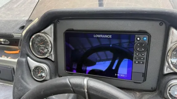 Slide: The Image of The image shows the dashboard of a 2021 Triton 20 TrX boat with a Lowrance HDS display. - 11