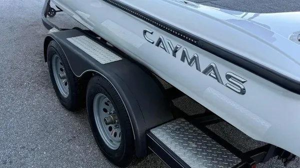 Slide: The Image of A Caymas CX 20 PRO boat on a trailer with dual wheels and non-slip step surfaces. - 6