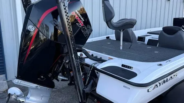 Slide: The Image of A 2022 Caymas CX 20 PRO with a powerful outboard motor, gray deck, and comfortable seating. - 4