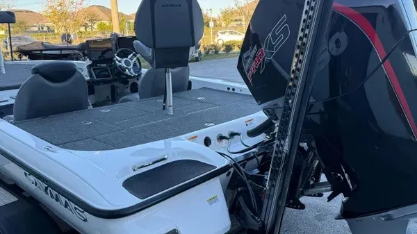 Slide: The Image of A 2022 Caymas CX 20 PRO with a spacious deck and a powerful outboard motor. - 5