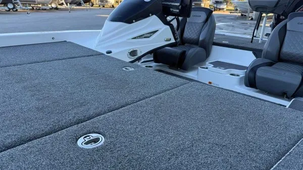 Slide: The Image of The image shows the cockpit of a 2022 Caymas CX 20 PRO boat with gray seats. - 12
