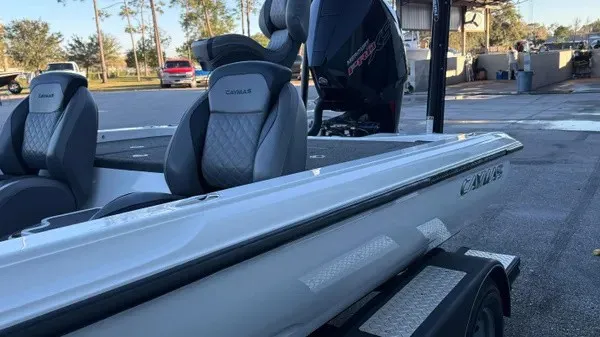 Slide: The Image of A white 2022 Caymas CX 20 PRO boat on a trailer in a parking area. - 7
