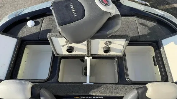 Slide: The Image of The image shows the storage area of a 2015 Ranger Z118 Comanche boat with open compartments. - 21