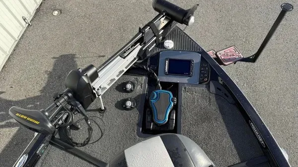 Slide: The Image of The image shows the cockpit of a 2015 Ranger Z118 Comanche boat with controls and electronics. - 11