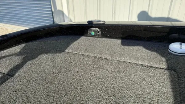 Slide: The Image of Close-up of the deck of a 2015 Ranger Z118 Comanche with carpeted surface. - 23