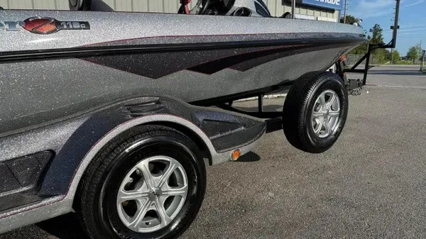 Slide: The Image of A 2015 Ranger Z118 Comanche on a trailer, featuring a sleek gray hull with black accents. - 4