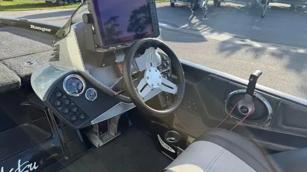 Slide: The Image of The image shows the cockpit of a 2015 Ranger Z118 Comanche with a modern helm station. - 16