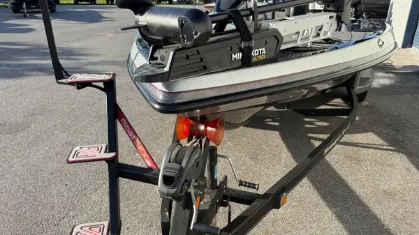 Slide: The Image of A 2015 Ranger Z118 Comanche on a trailer with a Minn Kota motor. - 10