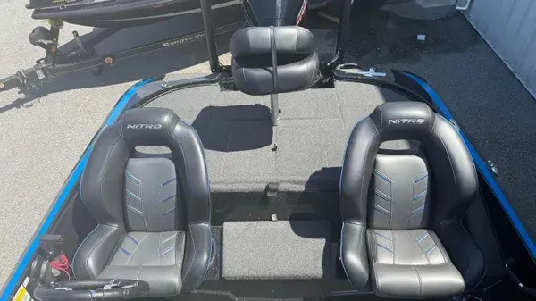 Slide: The Image of The image shows the cockpit of a Nitro Z18 boat with two padded seats. - 10