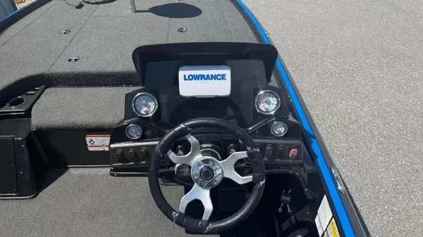 Slide: The Image of The image shows the cockpit of a 2022 Nitro Z18 boat with a Lowrance display. - 15