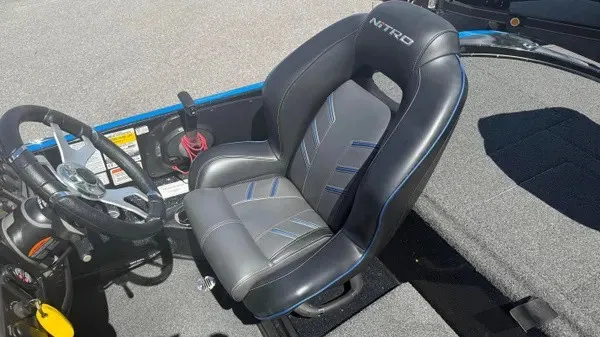 Slide: The Image of The 2022 Nitro Z18 features a sleek, cushioned seat with blue accents and a modern steering area. - 13