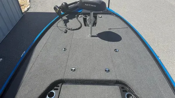 Slide: The Image of The image shows the deck of a 2022 Nitro Z18 boat with gray carpeting. - 11