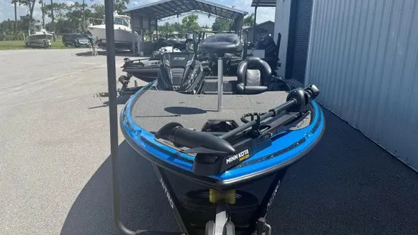 Slide: The Image of A blue 2022 Nitro Z18 boat is on a trailer in an outdoor storage area. - 9