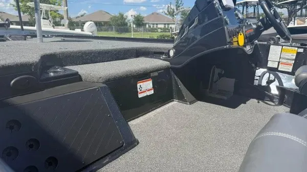 Slide: The Image of The image shows the cockpit of a 2022 Nitro Z18 boat with gray carpeting. - 17