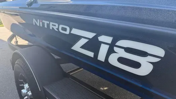 Slide: The Image of Close-up of a blue 2022 Nitro Z18 boat on a trailer. - 6