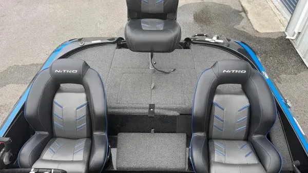 Slide: The Image of The image shows the cockpit of a 2022 Nitro Z18 boat with two cushioned seats. - 13
