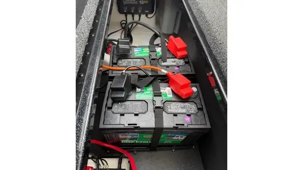 Slide: The Image of Two batteries are installed in a compartment of a Nitro Z18 boat. - 14