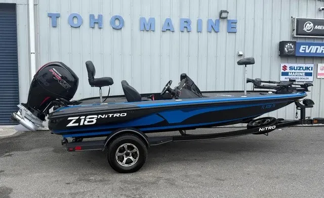 The Image of A 2022 Nitro Z18 boat on a trailer in front of a building labeled "TOHO MARINE." - 1