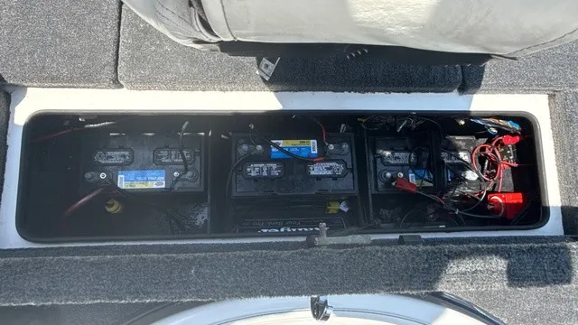 Slide: The Image of Battery compartment of a 2005 Ranger 520 VX Comanche boat with multiple batteries. - 17