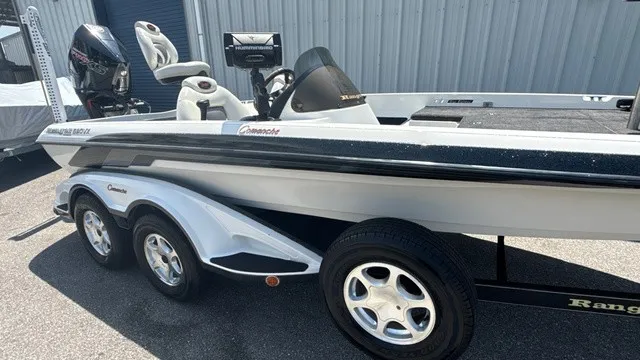 Slide: The Image of 2005 Ranger 520 VX Comanche with dual axle trailer and outboard motor. - 2