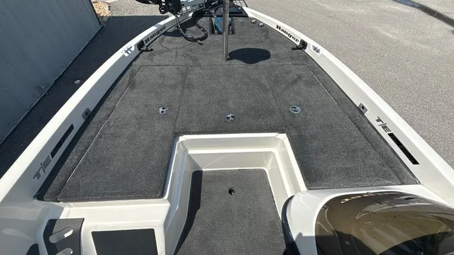 Slide: The Image of The image shows the deck of a 2005 Ranger 520 VX Comanche boat with gray carpeting. - 11