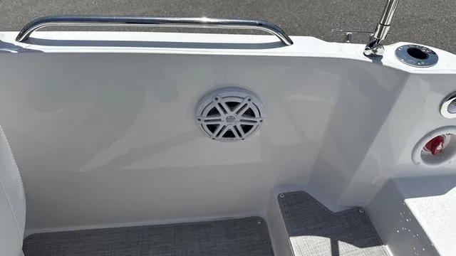 Slide: The Image of The image shows a boat interior with a speaker and a cup holder. - 11