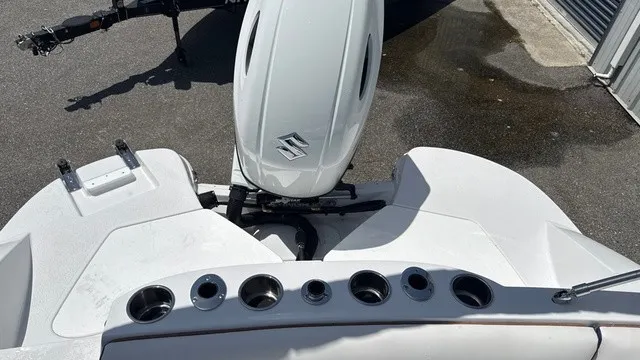 Slide: The Image of The image shows the stern of a Stingray 192 SC boat with a Suzuki outboard motor. - 13