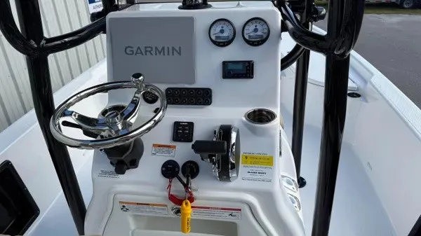 Slide: The Image of The image shows the helm of a Blazer PureBay 2400 boat with Garmin equipment. - 10