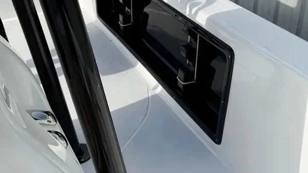 Slide: The Image of The image shows the deck of a Blazer PureBay 2400 boat with black fittings. - 18